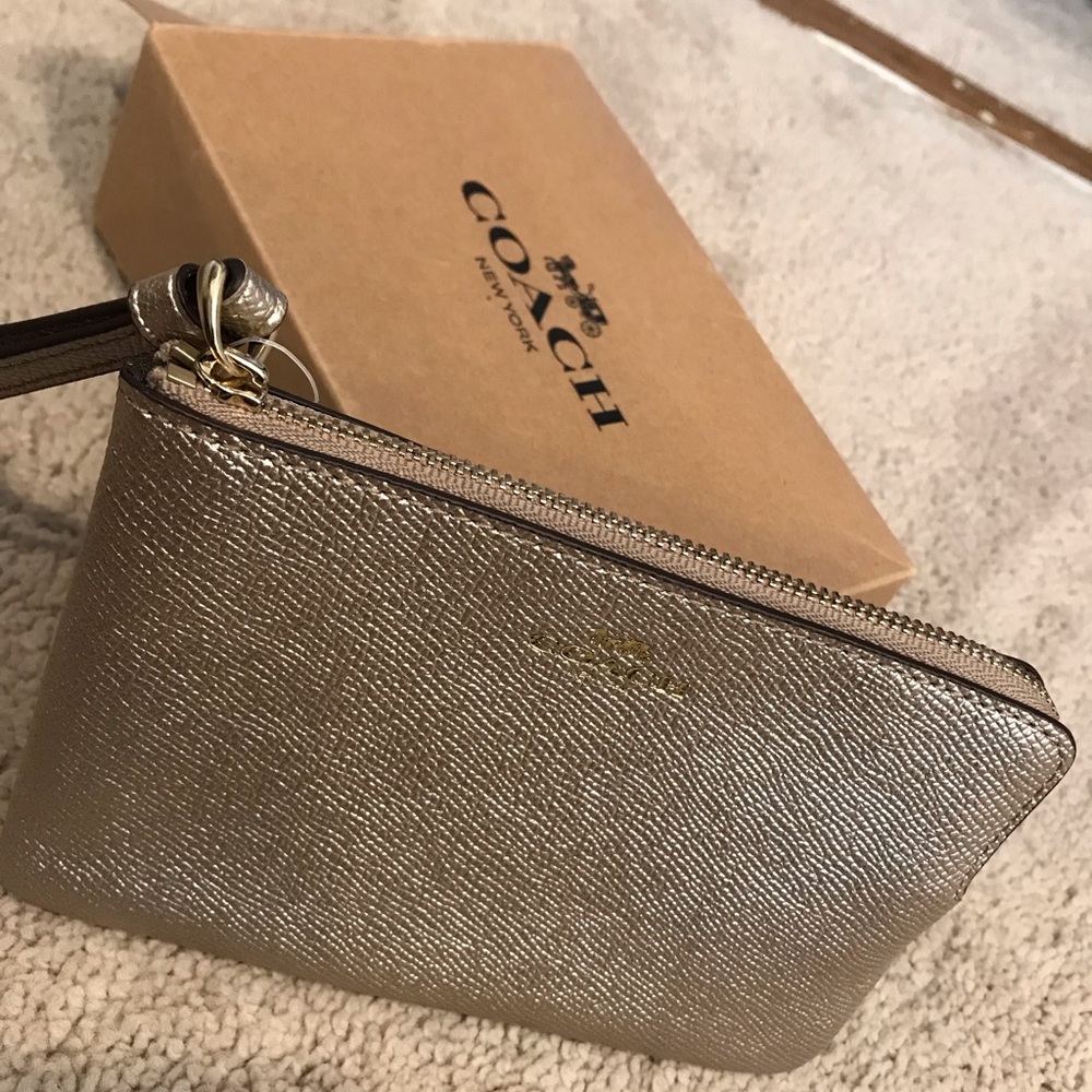 Coach wristlet - metallic gold